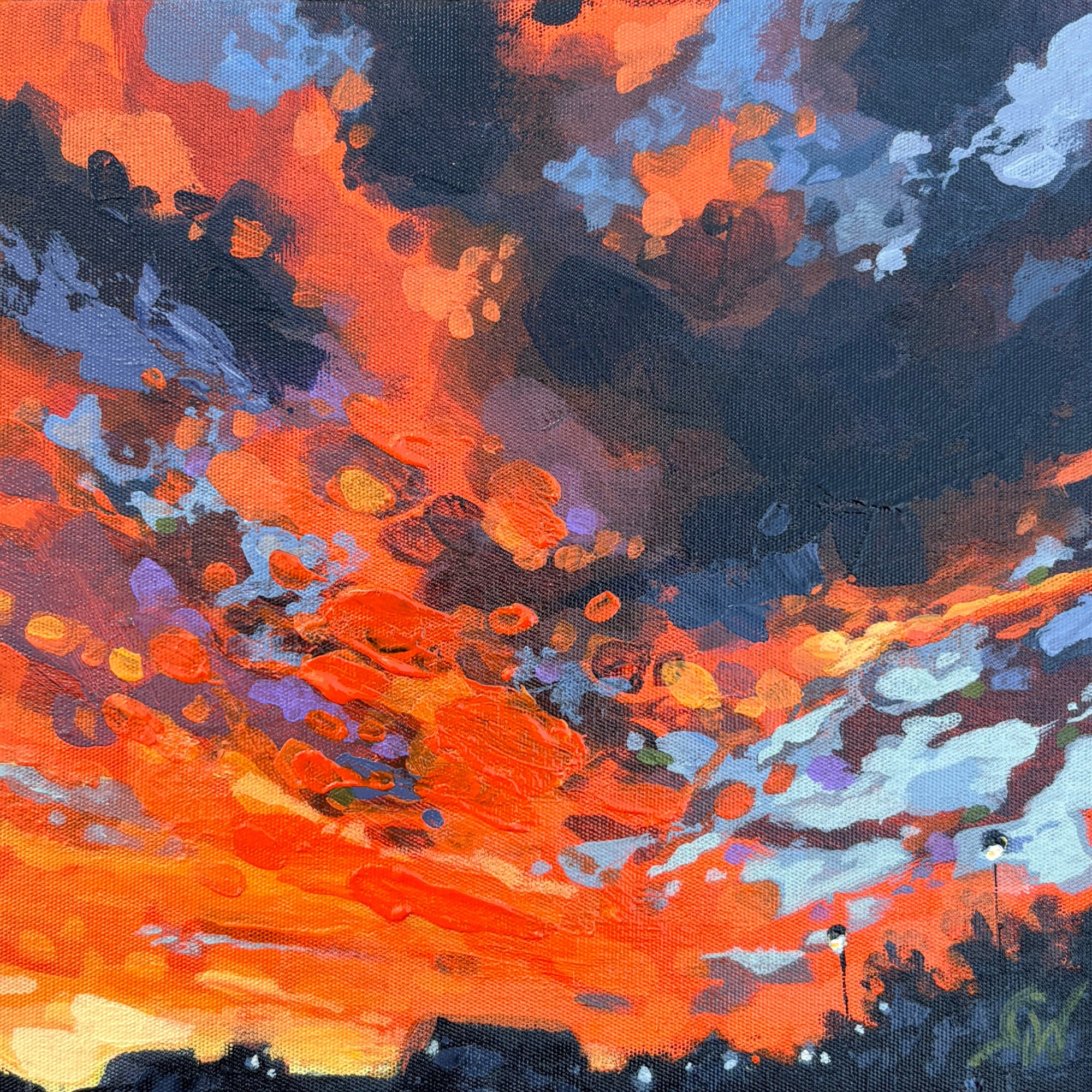 A square framed abstract painting featuring vibrant orange, red, black, and blue brushstrokes.